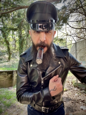 Wearing my new fag funded Perfecto leather jacket while enjoying an Asylum 8x80 cigar.